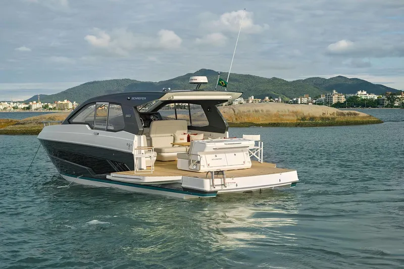  Yacht Photos Pics Modern Schaefer 380 yacht cruising near scenic coastline, 2025 model.