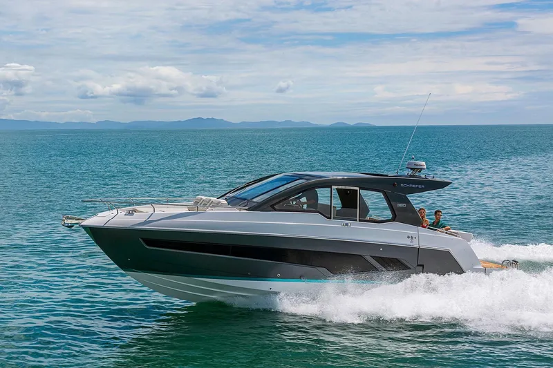  Yacht Photos Pics 2025 Schaefer 380 yacht cruising on open sea under clear skies.