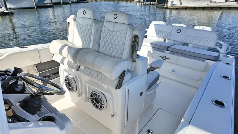  Yacht Photos Pics Luxurious 2022 Fountain 38TE boat interior with plush seating and modern design.