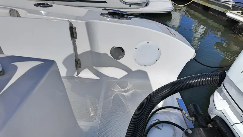  Yacht Photos Pics 2022 Fountain 38TE boat interior, showing deck details and water reflections.