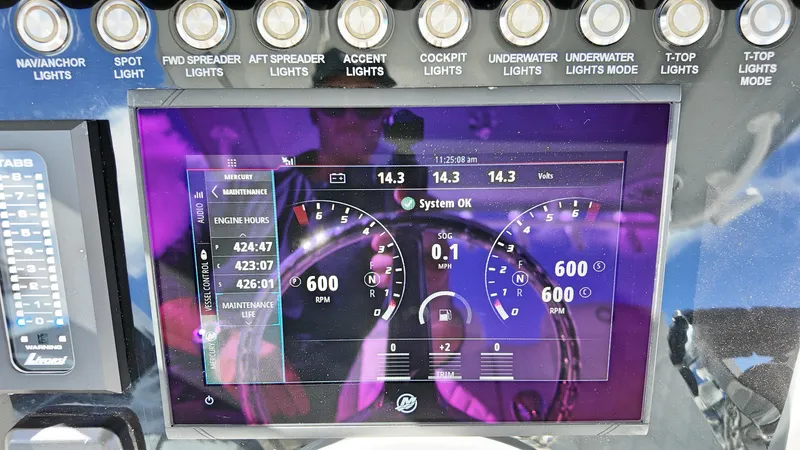  Yacht Photos Pics Dashboard of 2022 Fountain 38TE boat showing engine metrics and light controls.