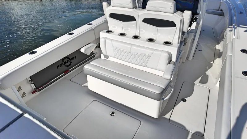  Yacht Photos Pics 2022 Fountain 38TE boat interior with white seating and cup holders.