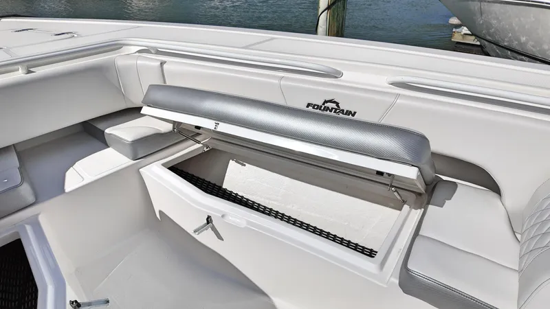  Yacht Photos Pics 2022 Fountain 38TE boat interior with open storage compartment, showcasing sleek design and functionality.