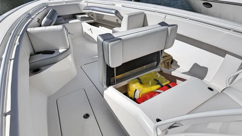  Yacht Photos Pics 2022 Fountain 38TE boat interior with seating and storage compartments.