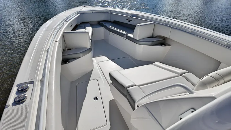  Yacht Photos Pics 2022 Fountain 38TE boat interior with sleek seating and modern design on the water.