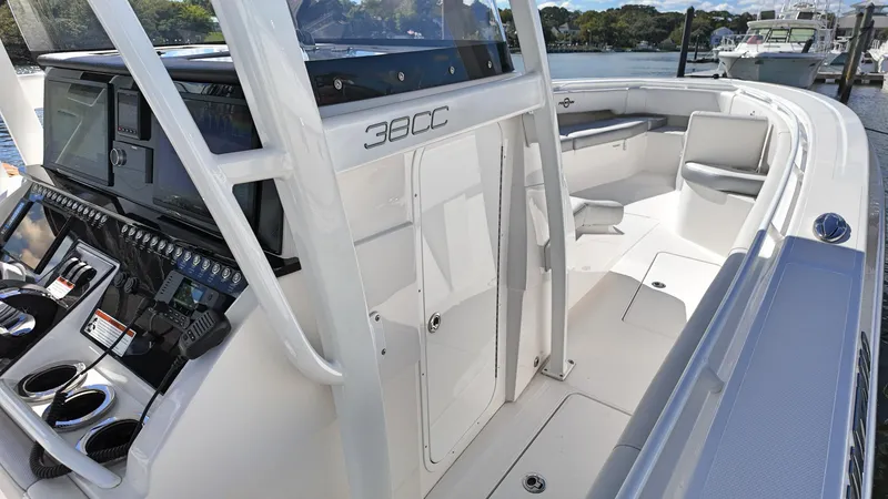  Yacht Photos Pics 2022 Fountain 38TE boat interior with modern controls and seating.