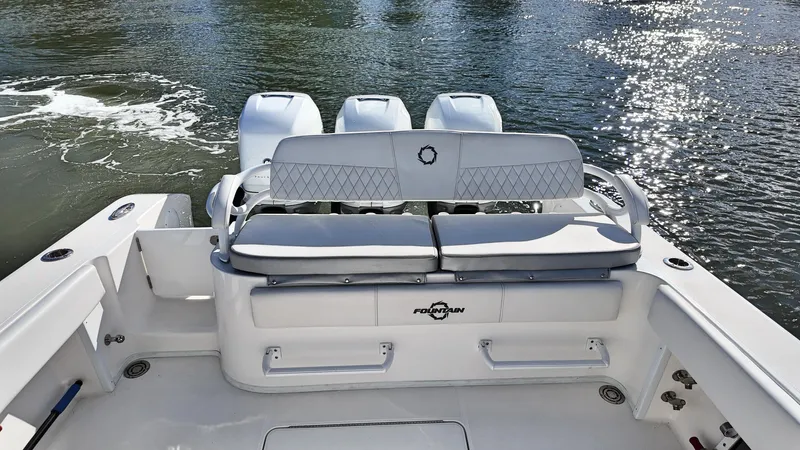  Yacht Photos Pics 2022 Fountain 38TE boat with triple engines, rear seating, and water view.
