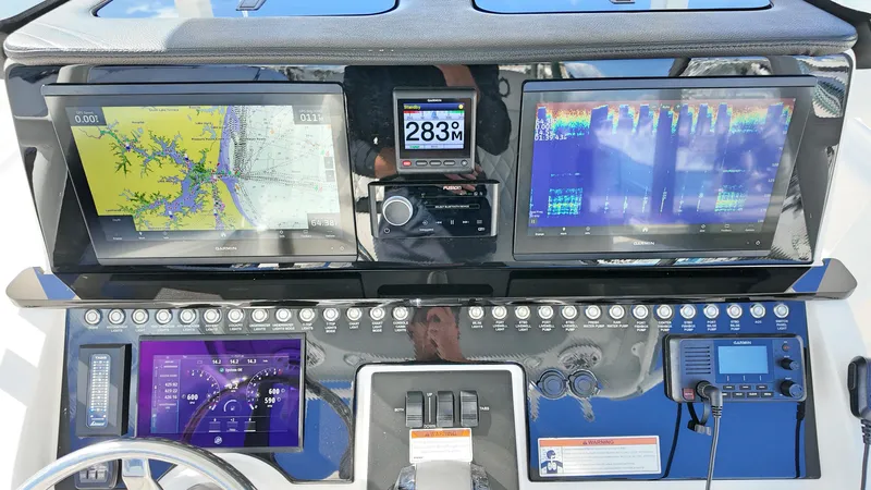  Yacht Photos Pics Control panel of 2022 Fountain 38TE boat with navigation and communication systems.