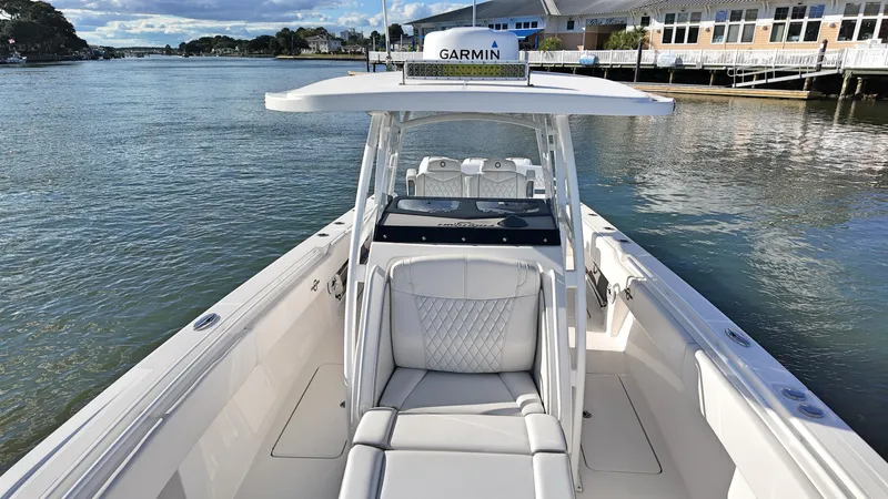  Yacht Photos Pics 2022 Fountain 38TE boat with Garmin equipment on a calm waterway.