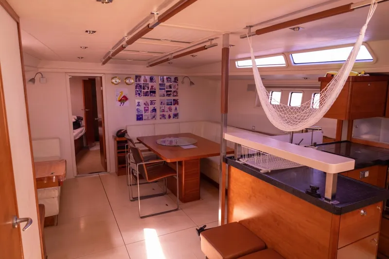 Ayacucho Yacht Photos Pics Interior of 2008 Hanse 630E yacht with dining area and hammock.