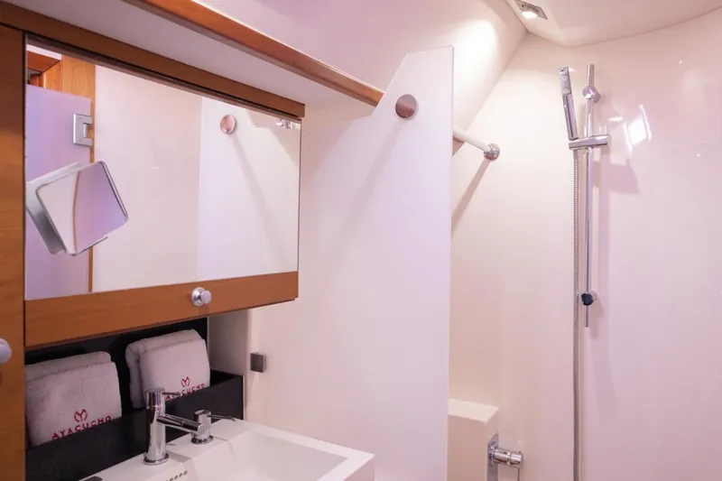 Ayacucho Yacht Photos Pics Luxurious bathroom in 2008 Hanse 630E yacht with modern fixtures and elegant design.