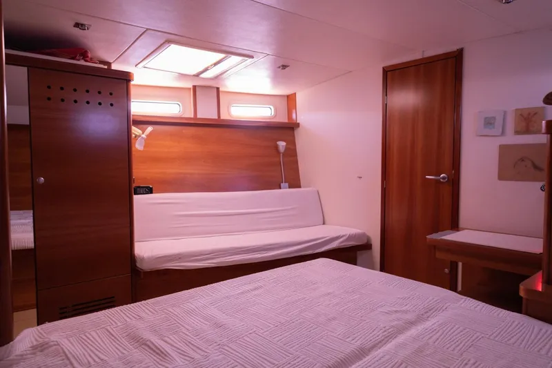 Ayacucho Yacht Photos Pics Interior of 2008 Hanse 630E yacht cabin with wooden furnishings and cozy seating.