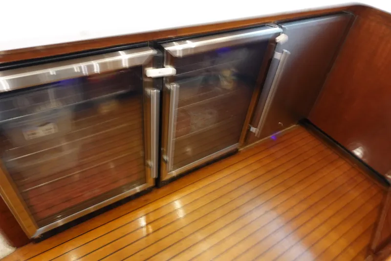  Yacht Photos Pics Wood-paneled interior with stainless steel appliances on a 1988 Donzi Z-65 Tournament Fisherman.