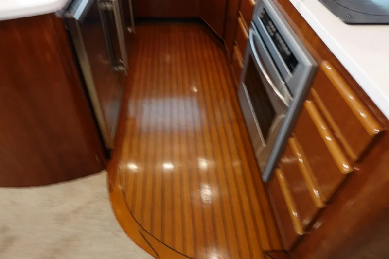  Yacht Photos Pics 1988 Donzi Z-65 Tournament Fisherman yacht kitchen with wood flooring and modern appliances.