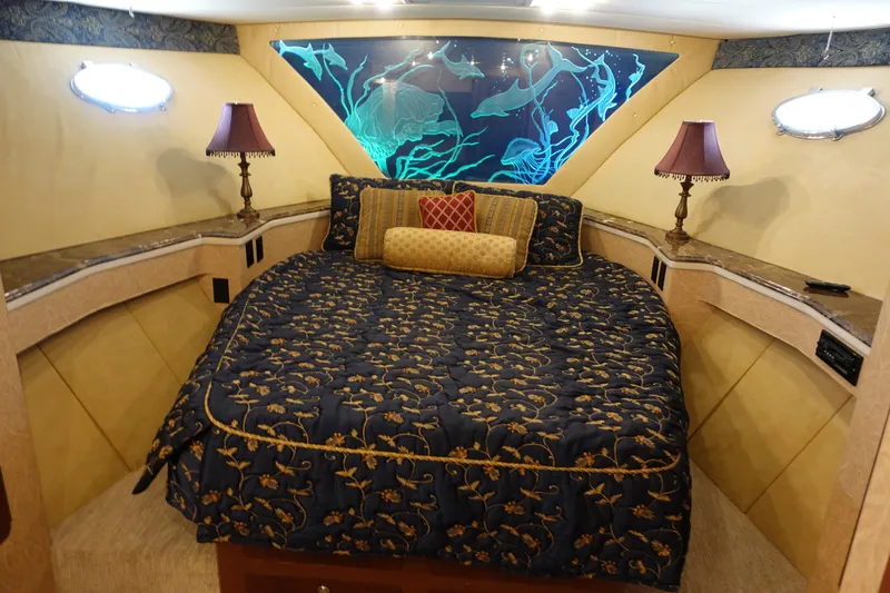  Yacht Photos Pics Luxurious cabin interior of 1988 Donzi Z-65 Tournament Fisherman with elegant bedding and decor.