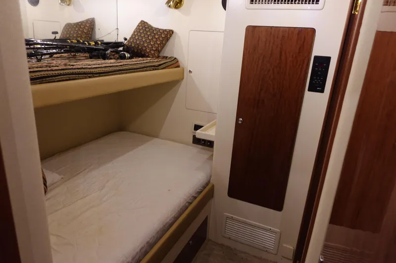  Yacht Photos Pics 1988 Donzi Z-65 Tournament Fisherman cabin with bunk beds and wood paneling.