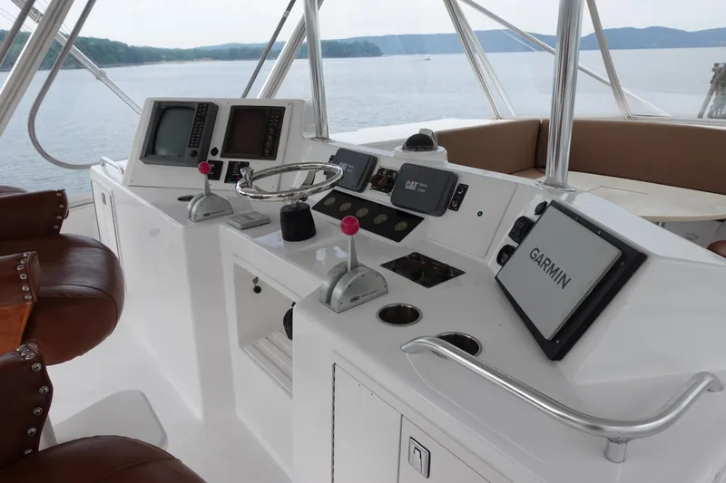  Yacht Photos Pics 1988 Donzi Z-65 Tournament Fisherman helm with Garmin navigation, leather seats, and scenic water view.