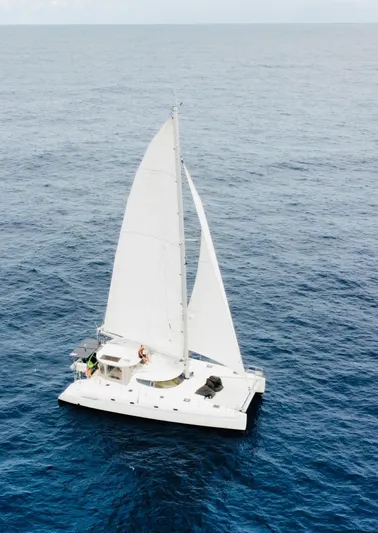 Savannah Yacht Photos Pics Sailing catamaran Fountaine Pajot Bahia 46, 1998 model, cruising on open ocean waters.
