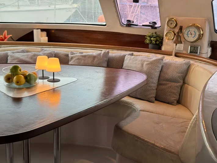 Savannah Yacht Photos Pics Luxurious interior of 1998 Fountaine Pajot Bahia 46 catamaran with cozy seating and elegant decor.