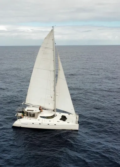 Savannah Yacht Photos Pics Sailing catamaran Fountaine Pajot Bahia 46, 1998 model, cruising on open ocean waters.