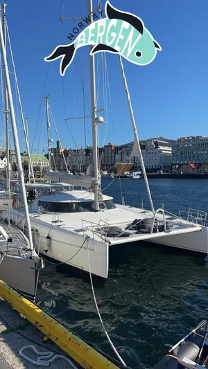 Savannah Yacht Photos Pics Catamaran Fountaine Pajot Bahia 46 docked in Bergen, Norway, under clear blue skies.