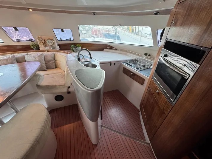 Savannah Yacht Photos Pics Interior of 1998 Fountaine Pajot Bahia 46 catamaran with kitchen and seating area.