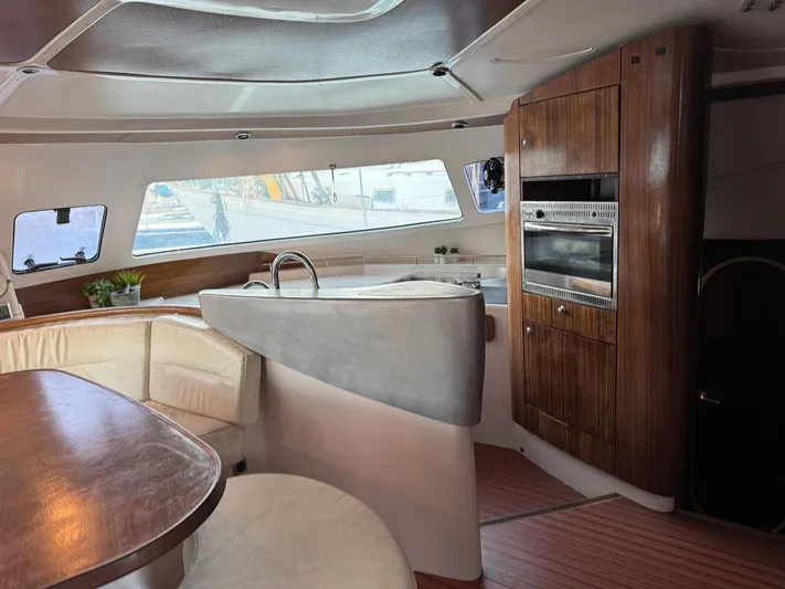 Savannah Yacht Photos Pics Interior of 1998 Fountaine Pajot Bahia 46 catamaran with modern kitchen and seating area.