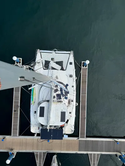 Savannah Yacht Photos Pics Overhead view of a 1998 Fountaine Pajot Bahia 46 catamaran docked at a marina.