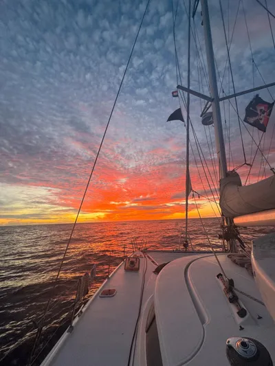 Savannah Yacht Photos Pics Sailing at sunset on a 1998 Fountaine Pajot Bahia 46 catamaran.