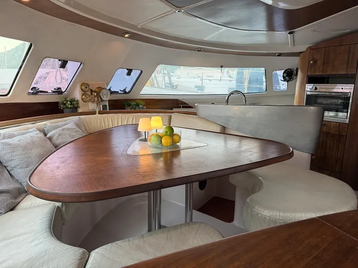 Savannah Yacht Photos Pics Luxurious interior of 1998 Fountaine Pajot Bahia 46 catamaran with elegant dining area.