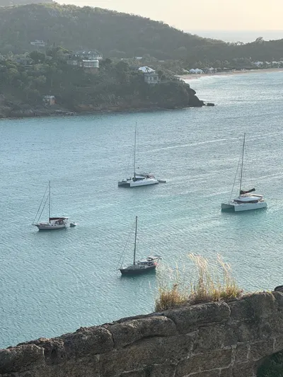 Savannah Yacht Photos Pics Sailboats anchored in a serene bay, featuring a 1998 Fountaine Pajot Bahia 46 catamaran.