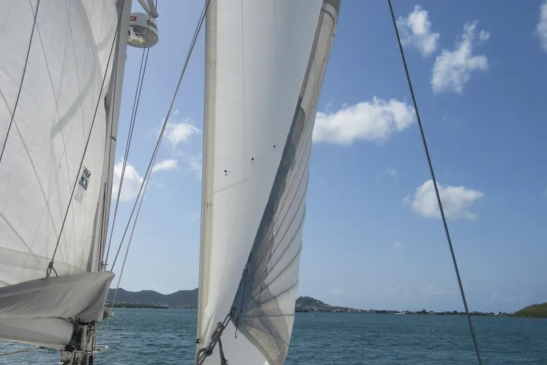 Savannah Yacht Photos Pics Sails of a 1998 Fountaine Pajot Bahia 46 catamaran against a clear blue sky.