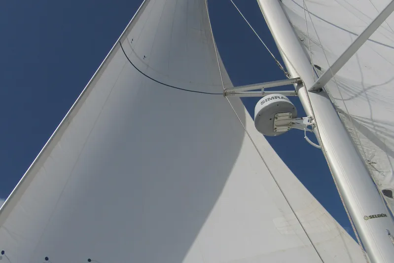 Savannah Yacht Photos Pics Sails of a 1998 Fountaine Pajot Bahia 46 catamaran against a clear blue sky.