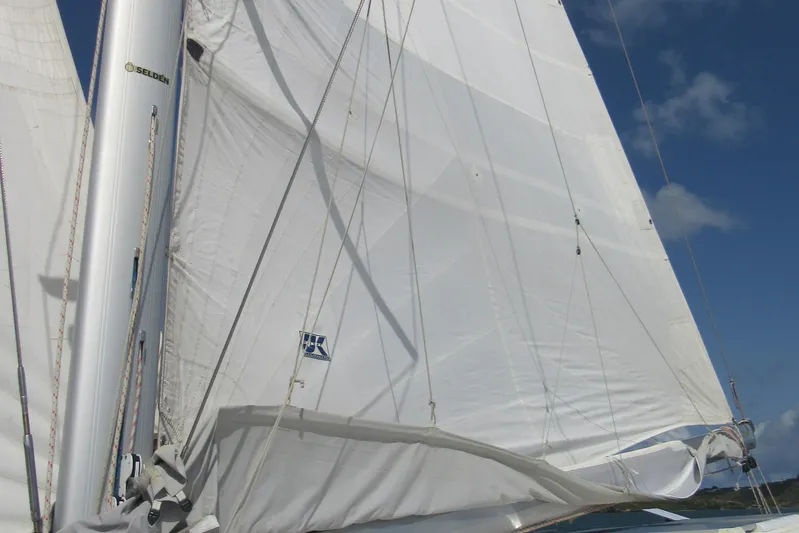 Savannah Yacht Photos Pics Sails of a 1998 Fountaine Pajot Bahia 46 catamaran against a clear blue sky.