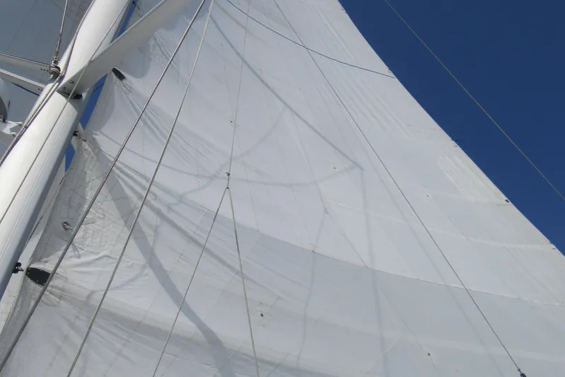 Savannah Yacht Photos Pics Sails of a 1998 Fountaine Pajot Bahia 46 catamaran against a clear blue sky.