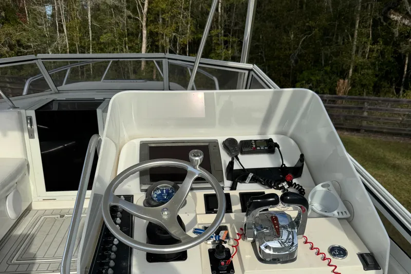  Yacht Photos Pics 2001 Contender 35 Side Console boat helm with steering wheel and controls.