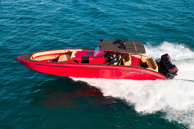  Yacht Photos Pics 2024 Midnight Express 43' Solstice speedboat cruising on open water.