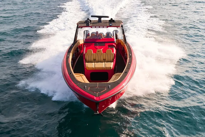  Yacht Photos Pics 2024 Midnight Express 43' Solstice boat cruising on open water, showcasing sleek design.