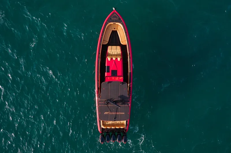  Yacht Photos Pics Aerial view of 2024 Midnight Express 43' Solstice boat on turquoise water.