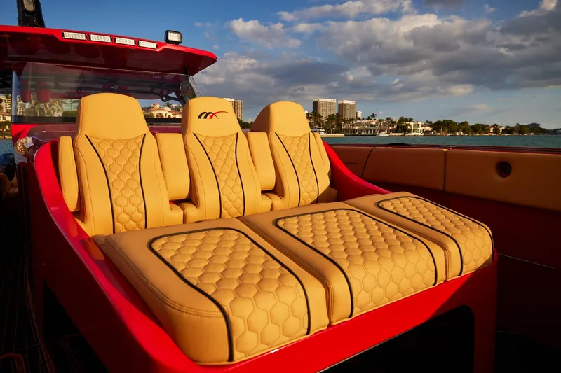  Yacht Photos Pics Luxurious seating on 2024 Midnight Express 43' Solstice boat, featuring elegant tan upholstery.
