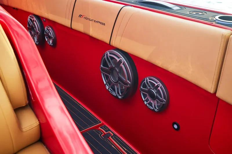  Yacht Photos Pics Red and tan interior of 2024 Midnight Express 43' Solstice with sleek speaker design.