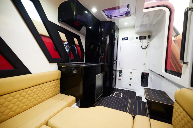  Yacht Photos Pics Luxurious interior of 2024 Midnight Express 43' Solstice boat with modern seating and kitchenette.