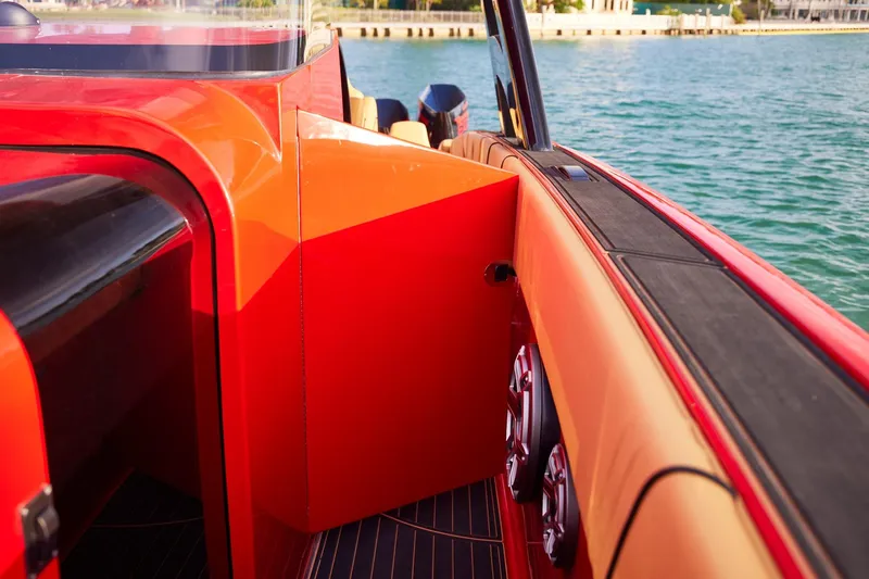  Yacht Photos Pics 2024 Midnight Express 43' Solstice boat interior with vibrant red and orange accents.