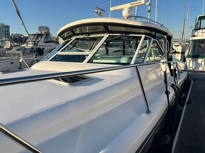  Yacht Photos Pics 2003 Tiara Yachts 3500 Open docked, showcasing sleek design and spacious deck.