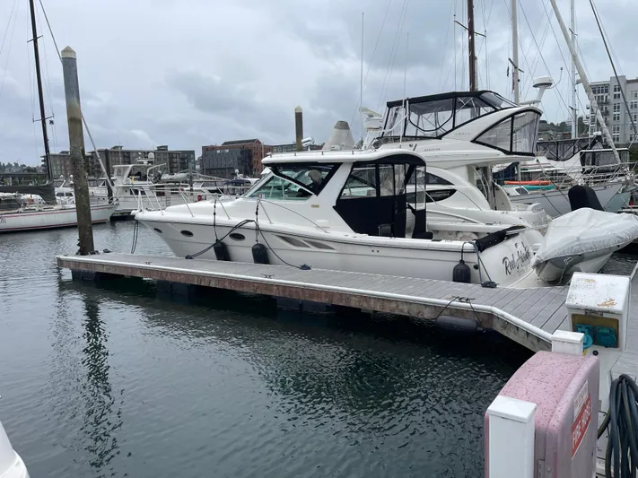  Yacht Photos Pics 2003 Tiara Yachts 3500 Open docked in a marina, surrounded by other boats.