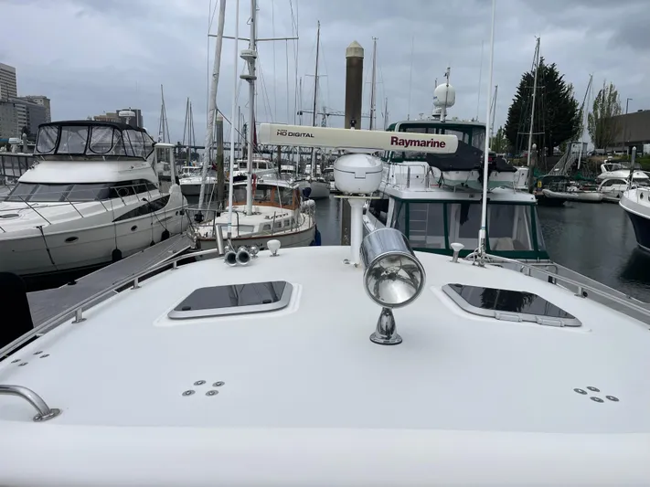  Yacht Photos Pics 2003 Tiara Yachts 3500 Open docked in a marina, surrounded by other boats.