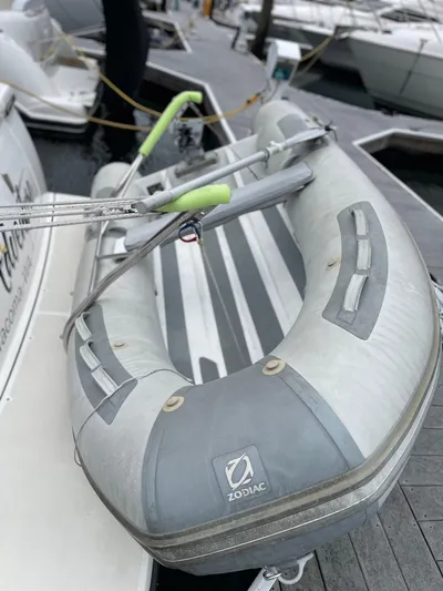  Yacht Photos Pics Inflatable Zodiac boat docked beside a 2003 Tiara Yachts 3500 Open.
