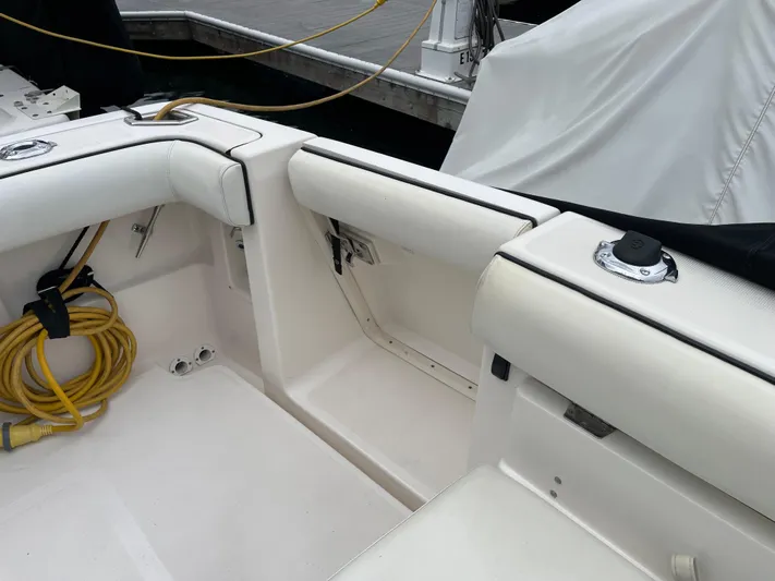  Yacht Photos Pics 2003 Tiara Yachts 3500 Open interior with white seating and docked at marina.