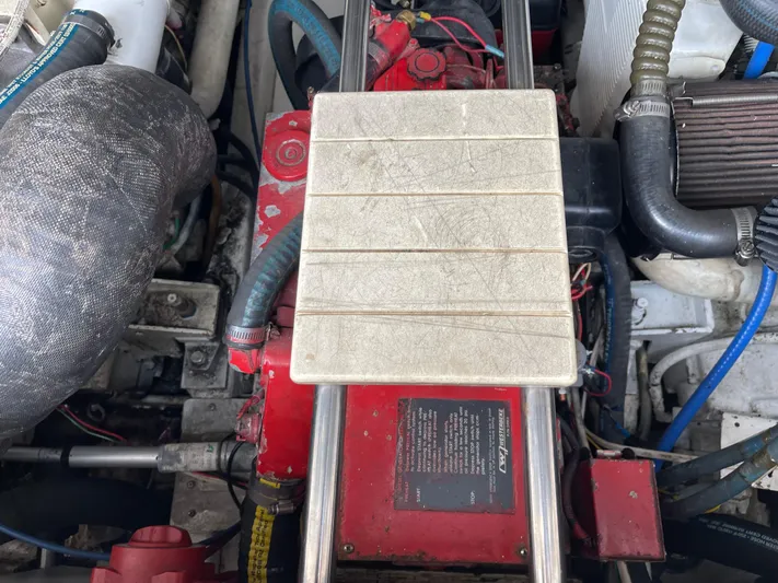  Yacht Photos Pics Engine compartment of a 2003 Tiara Yachts 3500 Open, showcasing mechanical components and wiring.