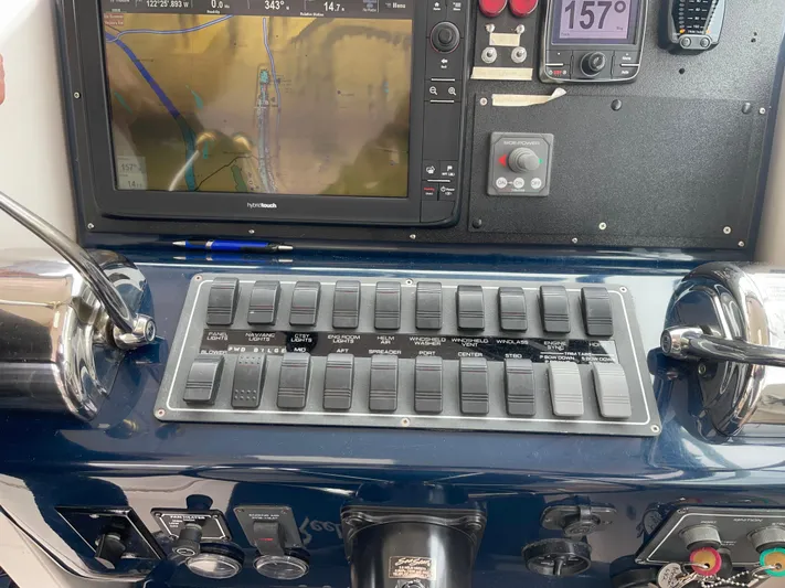  Yacht Photos Pics Control panel of a 2003 Tiara Yachts 3500 Open with navigation display and switches.